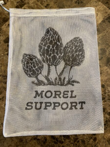 White mesh back with Morel Graphic and text that says Morel Support